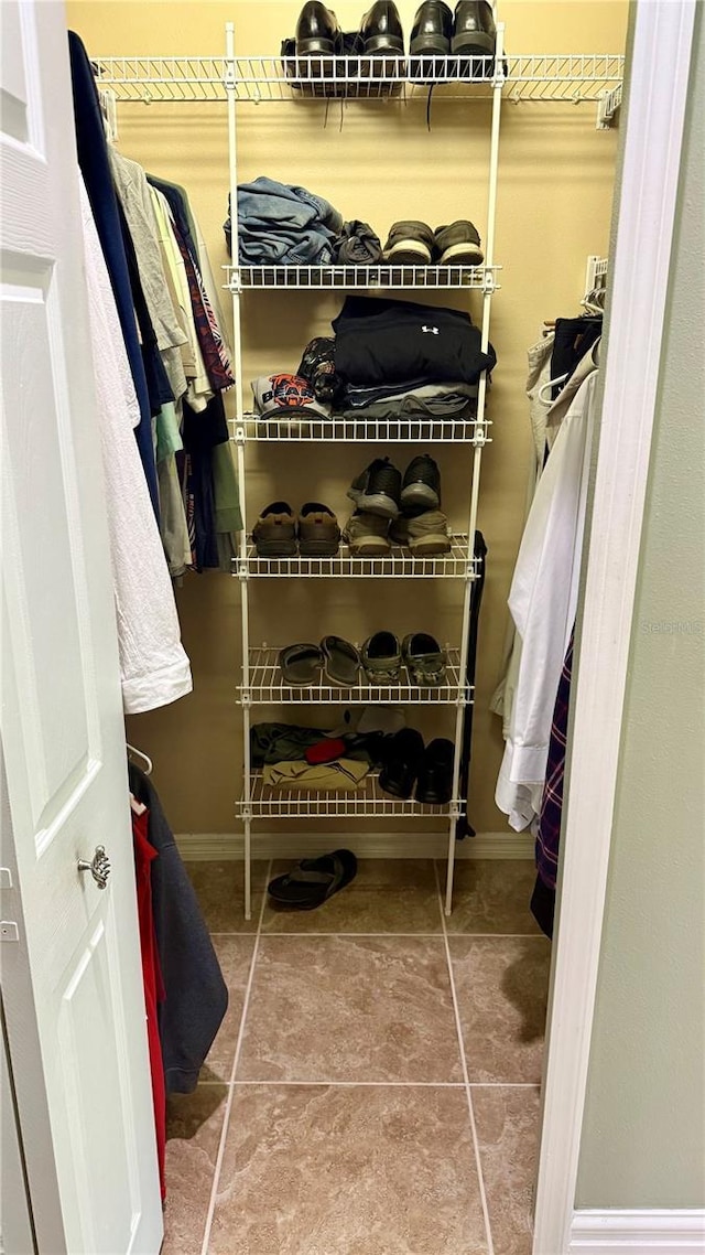 1138 Lumsden Trace Cir, Valrico, FL 33594 - walk in closet featuring tile patterned flooring