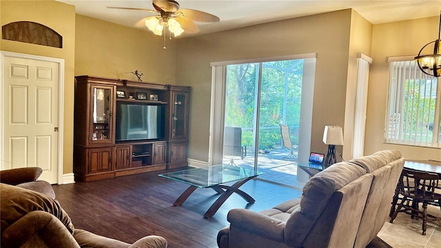 1138 Lumsden Trace Cir, Valrico, FL 33594 - living area with ceiling fan, a chandelier, wood finished floors, and baseboards