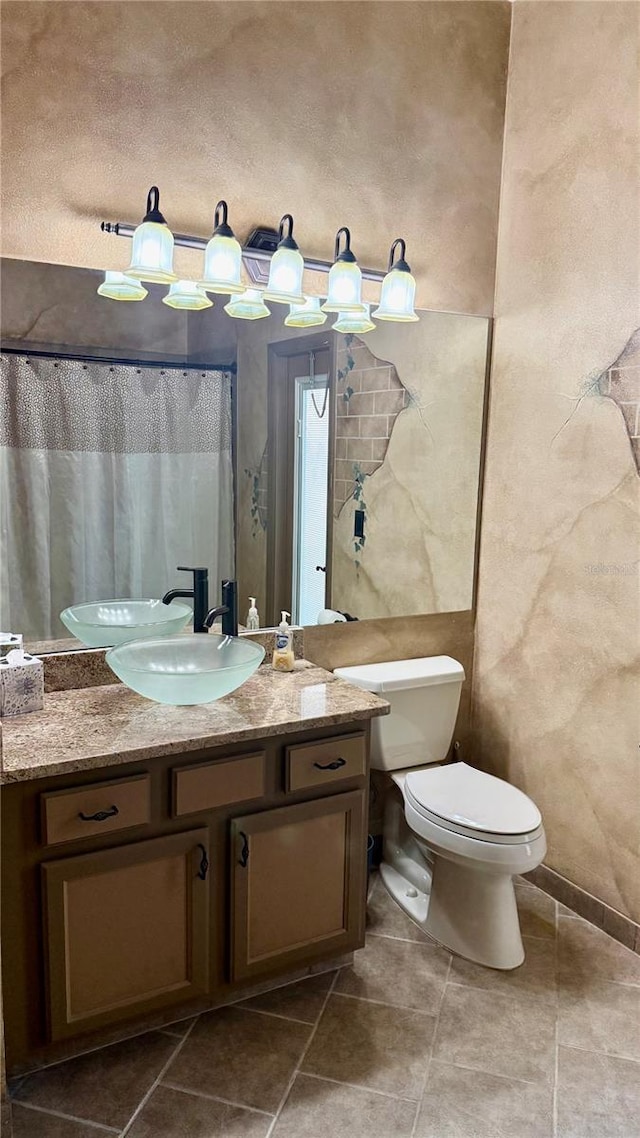 1138 Lumsden Trace Cir, Valrico, FL 33594 - bathroom featuring vanity, toilet, and tile patterned flooring