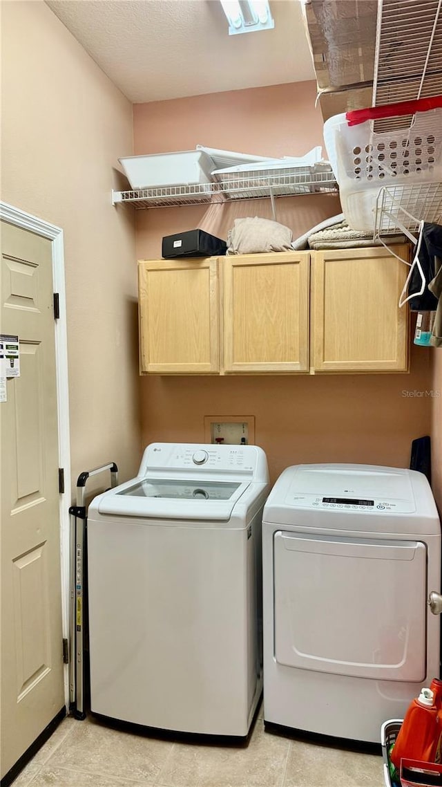 1138 Lumsden Trace Cir, Valrico, FL 33594 - washroom with cabinet space, separate washer and dryer, and light tile patterned flooring