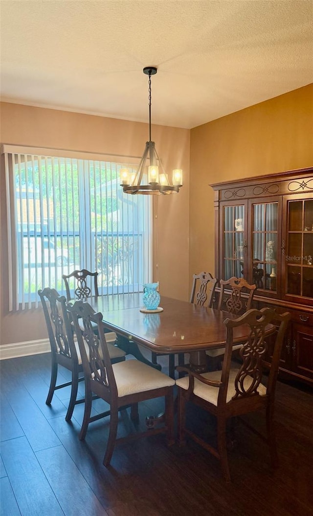 1138 Lumsden Trace Cir, Valrico, FL 33594 - dining space with a chandelier, wood finished floors, and baseboards