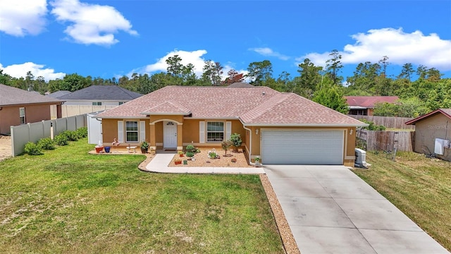 16969 SW 40th Cir, Ocala, FL 34473 - view of front of property with stucco siding, an attached garage, and driveway
