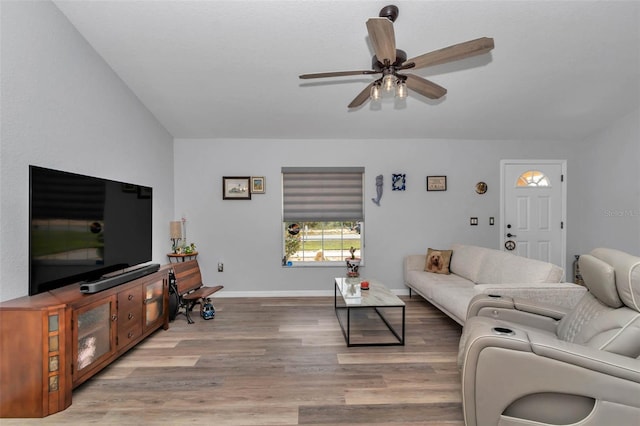 16969 SW 40th Cir, Ocala, FL 34473 - living area with a ceiling fan, light wood-style floors, and baseboards