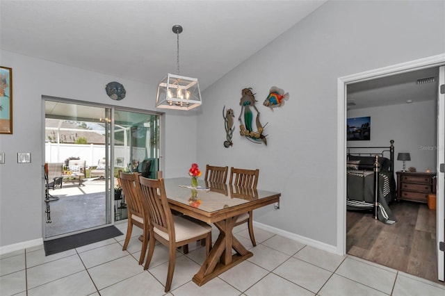 16969 SW 40th Cir, Ocala, FL 34473 - dining area featuring baseboards, a chandelier, and light tile patterned flooring