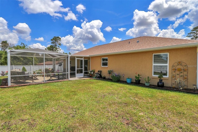 16969 SW 40th Cir, Ocala, FL 34473 - rear view of property with stucco siding, glass enclosure, and a patio