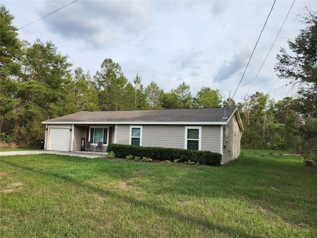 120 Fisher Ct, Ocklawaha, FL 32179 - ranch-style home featuring an attached garage, a front yard, and concrete driveway