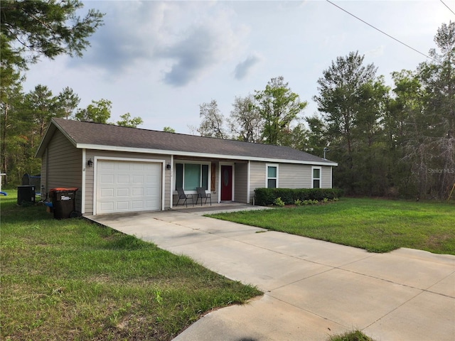 120 Fisher Ct, Ocklawaha, FL 32179 - single story home with a garage, driveway, cooling unit, and a front lawn
