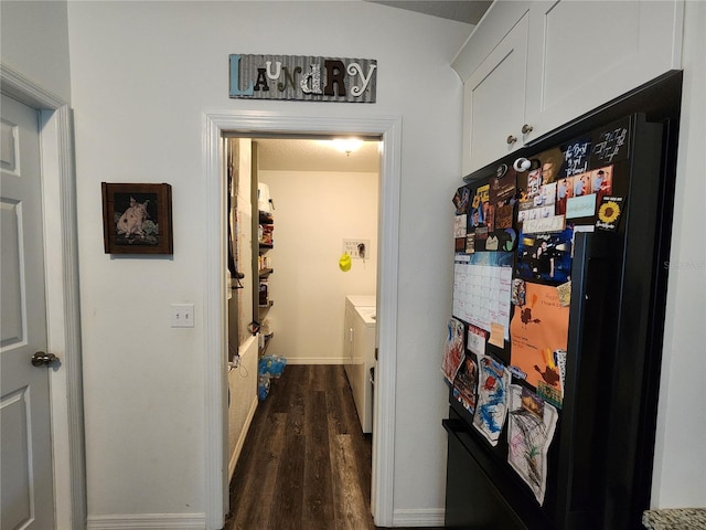 120 Fisher Ct, Ocklawaha, FL 32179 - hall with dark wood-style floors, baseboards, and washing machine and clothes dryer