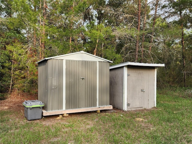 120 Fisher Ct, Ocklawaha, FL 32179 - view of shed with a forest view