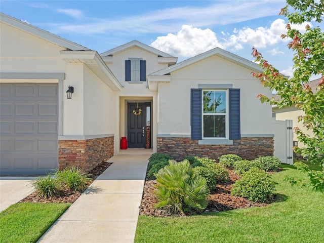 7206 SW 60th Ln, Ocala, FL 34474 - view of front of house with stone siding, stucco siding, a garage, and a front yard