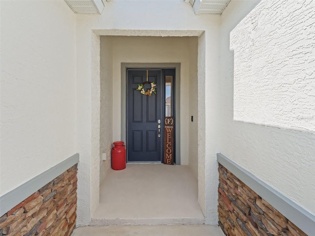 7206 SW 60th Ln, Ocala, FL 34474 - view of exterior entry featuring stucco siding