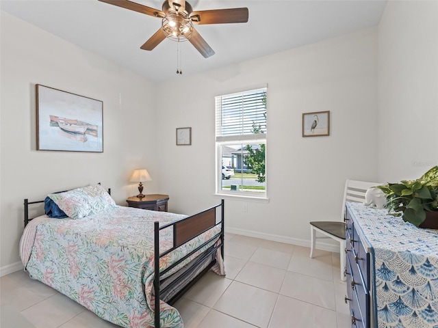 7206 SW 60th Ln, Ocala, FL 34474 - bedroom with baseboards, light tile patterned flooring, and ceiling fan