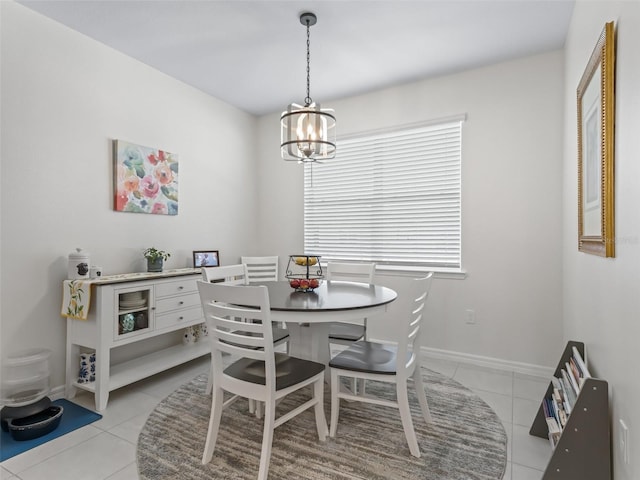 7206 SW 60th Ln, Ocala, FL 34474 - dining space featuring light tile patterned floors, a chandelier, and baseboards