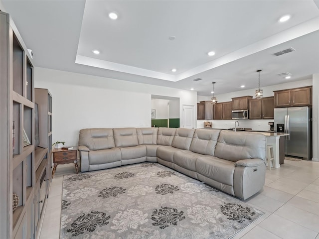7206 SW 60th Ln, Ocala, FL 34474 - living area featuring light tile patterned floors, recessed lighting, and a tray ceiling