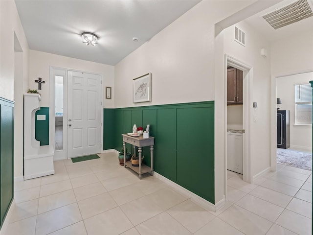 7206 SW 60th Ln, Ocala, FL 34474 - foyer featuring light tile patterned floors and wainscoting