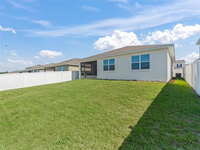 7206 SW 60th Ln, Ocala, FL 34474 - back of house with stucco siding and a sunroom