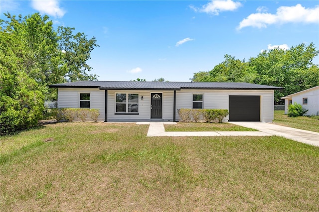 4095 SW 144th St, Ocala, FL 34473 - single story home with a garage, driveway, metal roof, and a front yard