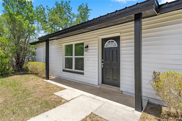 4095 SW 144th St, Ocala, FL 34473 - doorway to property featuring a lawn