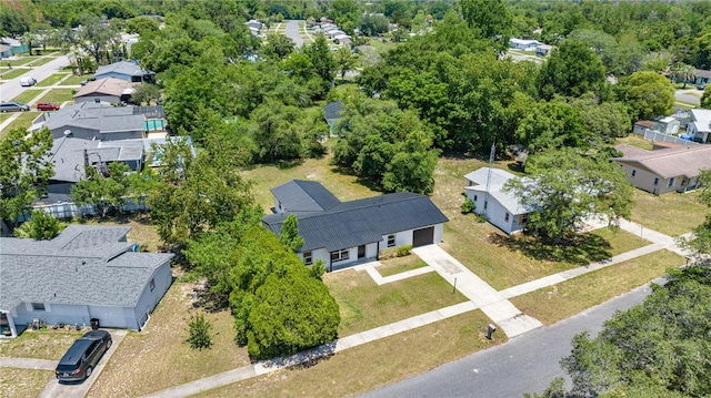 4095 SW 144th St, Ocala, FL 34473 - aerial perspective of suburban area featuring a tree filled landscape