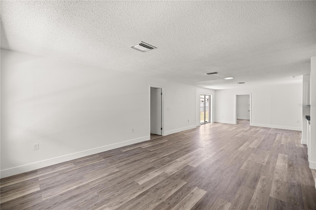 4095 SW 144th St, Ocala, FL 34473 - unfurnished room featuring a textured ceiling, wood finished floors, and baseboards