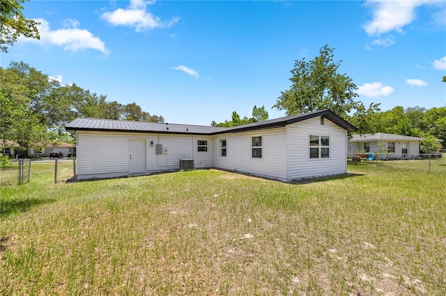 4095 SW 144th St, Ocala, FL 34473 - back of house featuring metal roof and central AC unit