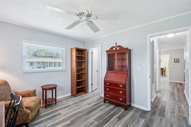 6448 SW 111th Pl, Ocala, FL 34476 - living area with wood finished floors, ceiling fan, crown molding, and baseboards