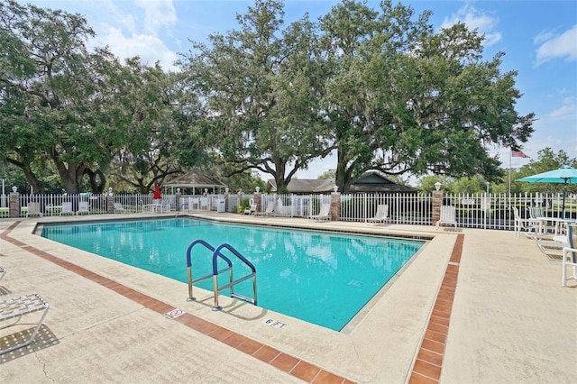 6448 SW 111th Pl, Ocala, FL 34476 - community pool featuring a patio area