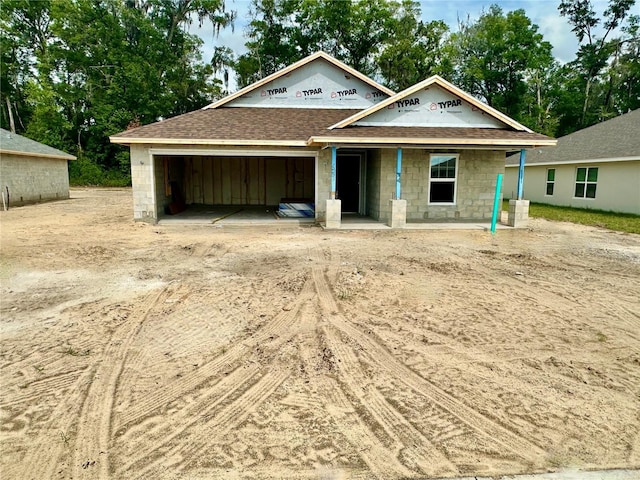 3131 NE 46th Ave, Ocala, FL 34470 - property in mid-construction featuring a garage, dirt driveway, and a shingled roof