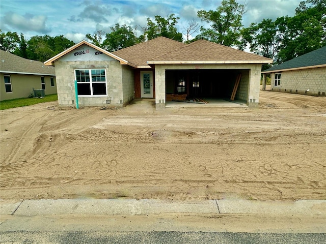 3167 NE 46th Ave, Ocala, FL 34470 - property in mid-construction with an attached garage, roof with shingles, and central AC
