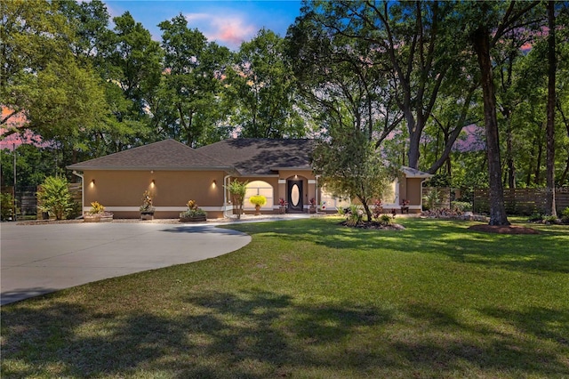 200 SE 145th St, Summerfield, FL 34491 - ranch-style house with stucco siding, curved driveway, and a front lawn