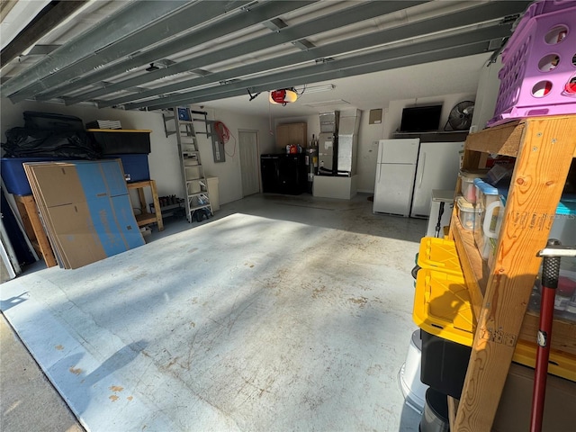 5263 NW 62nd Ave NW, Ocala, FL 34482 - garage featuring freestanding refrigerator, a garage door opener, and heating unit