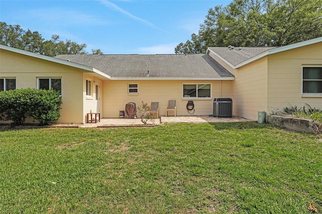 8785 SW 93rd Ln Unit C, Ocala, FL 34481 - back of property with a patio, central AC, a yard, and roof with shingles