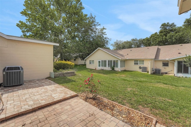 8785 SW 93rd Ln Unit C, Ocala, FL 34481 - view of grassy yard featuring cooling unit and a patio area