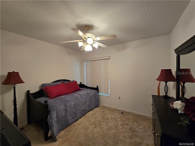 4710 W Mustang Blvd, Beverly Hills, FL 34465 - bedroom with light carpet, a textured ceiling, baseboards, and ceiling fan