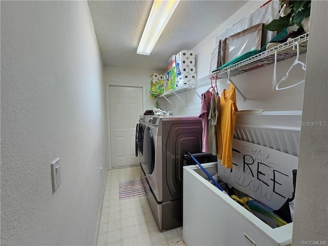 4710 W Mustang Blvd, Beverly Hills, FL 34465 - washroom featuring light floors, separate washer and dryer, a textured wall, and a textured ceiling