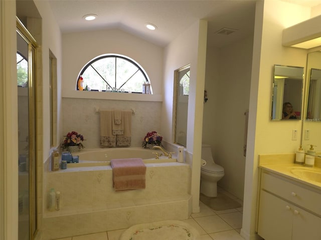 4710 W Mustang Blvd, Beverly Hills, FL 34465 - bathroom with vanity, plenty of natural light, a garden tub, tile patterned floors, and lofted ceiling
