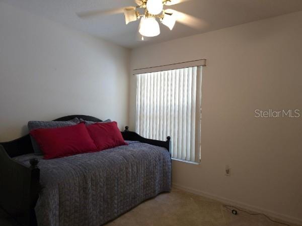 4710 W Mustang Blvd, Beverly Hills, FL 34465 - carpeted bedroom featuring ceiling fan and baseboards