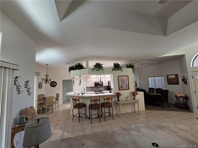 4710 W Mustang Blvd, Beverly Hills, FL 34465 - dining room featuring light tile patterned flooring and a chandelier