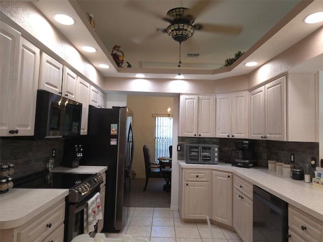4710 W Mustang Blvd, Beverly Hills, FL 34465 - kitchen featuring black appliances, a ceiling fan, a tray ceiling, light tile patterned flooring, and wine cooler