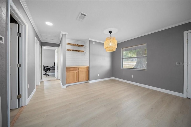 219 Marion Oaks Ln, Ocala, FL 34473 - empty room featuring light wood-type flooring, crown molding, attic access, and baseboards