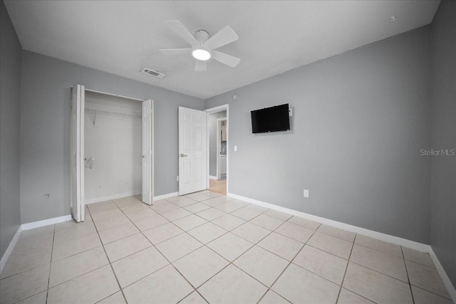 219 Marion Oaks Ln, Ocala, FL 34473 - unfurnished bedroom featuring light tile patterned floors, baseboards, a closet, and a ceiling fan