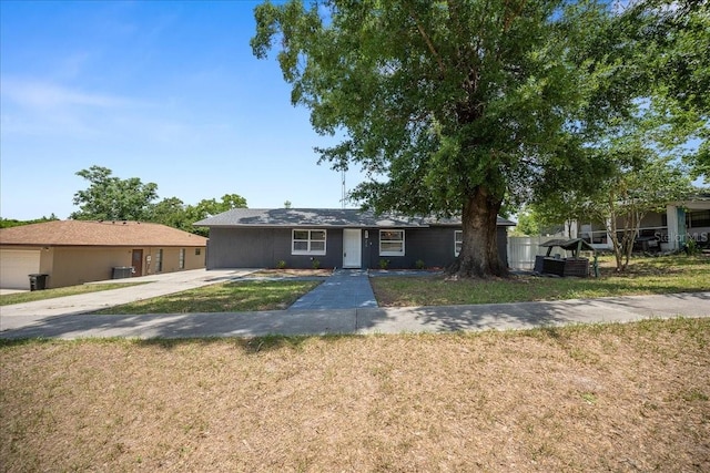 219 Marion Oaks Ln, Ocala, FL 34473 - ranch-style home with a front yard and concrete driveway
