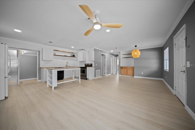 219 Marion Oaks Ln, Ocala, FL 34473 - unfurnished living room featuring ornamental molding, a sink, light wood-style flooring, recessed lighting, and baseboards