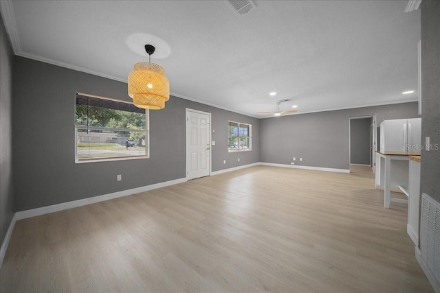 219 Marion Oaks Ln, Ocala, FL 34473 - unfurnished living room featuring crown molding, light wood-type flooring, baseboards, and recessed lighting