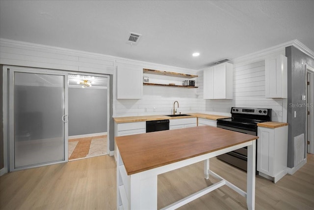 219 Marion Oaks Ln, Ocala, FL 34473 - kitchen with butcher block counters, stainless steel electric range, a sink, white cabinetry, and ornamental molding