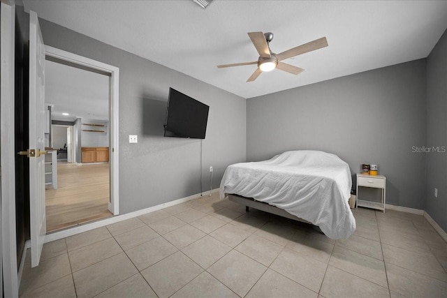 219 Marion Oaks Ln, Ocala, FL 34473 - bedroom featuring light tile patterned flooring, baseboards, and ceiling fan