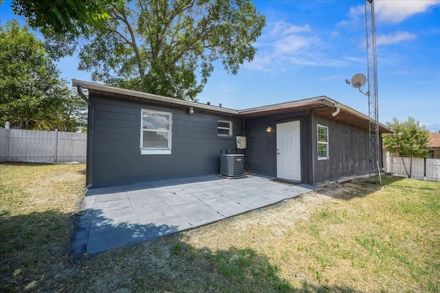 219 Marion Oaks Ln, Ocala, FL 34473 - rear view of house with a patio area and central AC unit