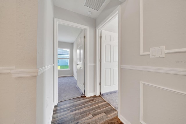 8943 SE 41st Court Rd, Ocala, FL 34480 - corridor with dark wood-style floors, a textured wall, and baseboards
