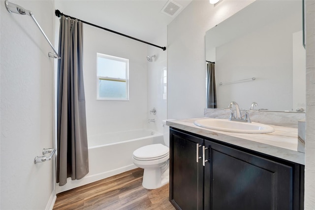 8943 SE 41st Court Rd, Ocala, FL 34480 - full bathroom featuring shower / bathtub combination with curtain, wood finished floors, vanity, and toilet