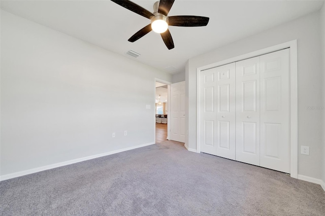 8943 SE 41st Court Rd, Ocala, FL 34480 - unfurnished bedroom with carpet flooring, baseboards, a closet, and ceiling fan